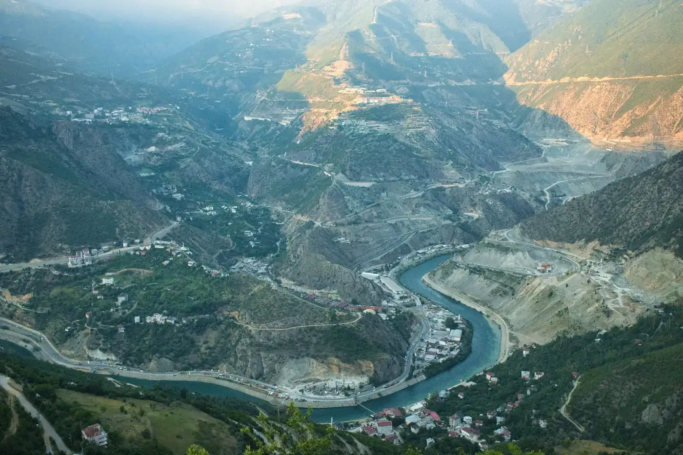 A breathtaking aerial shot of the river winding through Artvin's lush landscape in Türkiye.