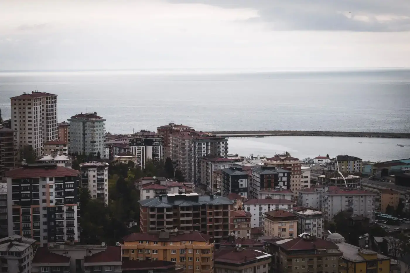 Stunning aerial shot of Rize cityscape with buildings by the Black Sea in Türkiye.