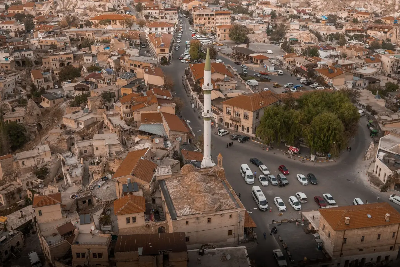 Stunning aerial view of Ortahisar, featuring a prominent minaret amidst urban townscape and traditional roofs.