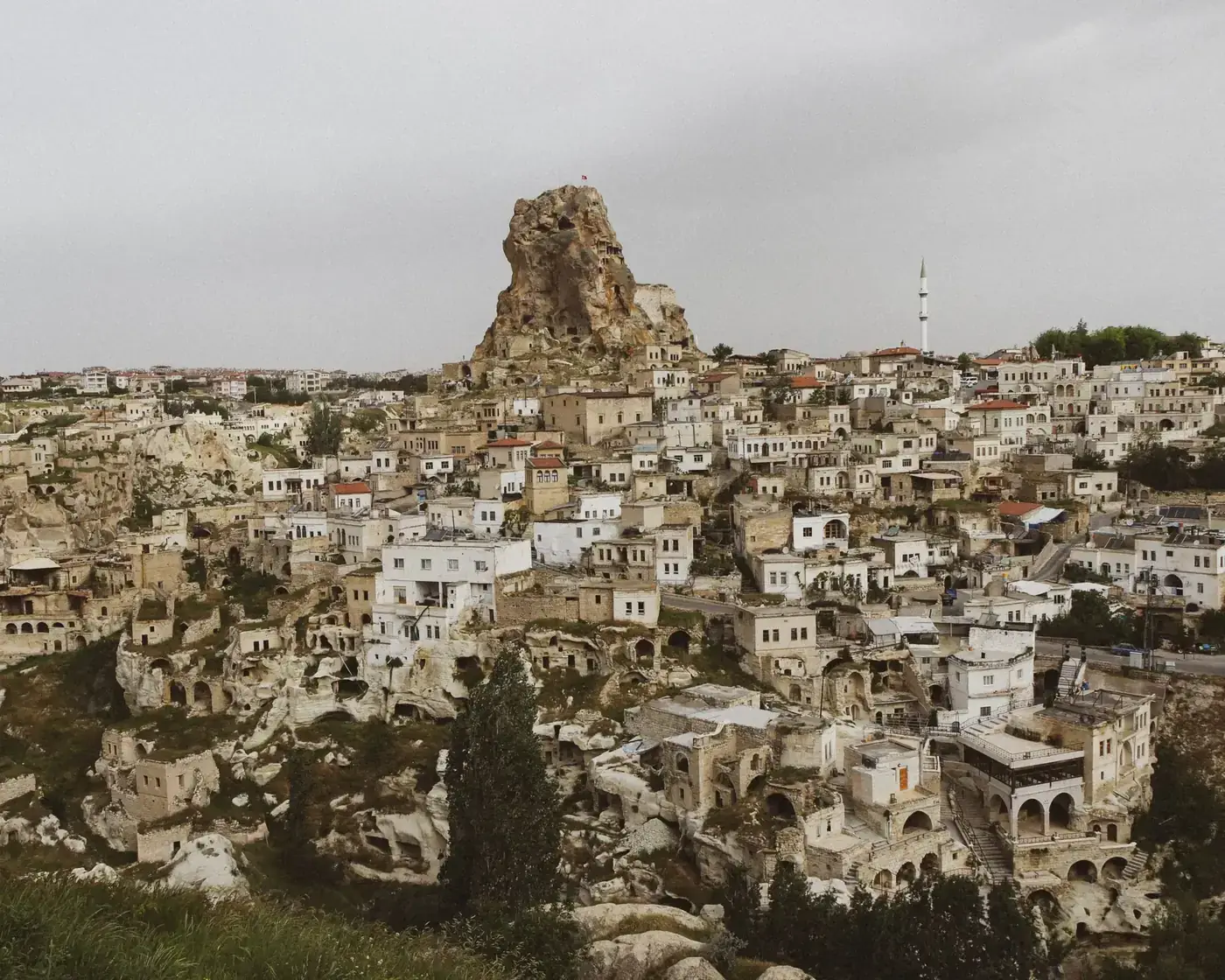 Panoramic view of Ortahisar Castle and surrounding cave dwellings in Turkey.