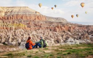 Couple of travelers enjoying landscape in Turkey, Cappadocia